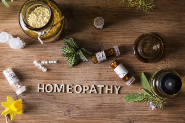 homeopathy globules and bottles Table with written text Homeopathy, homeopathy globules and bottles