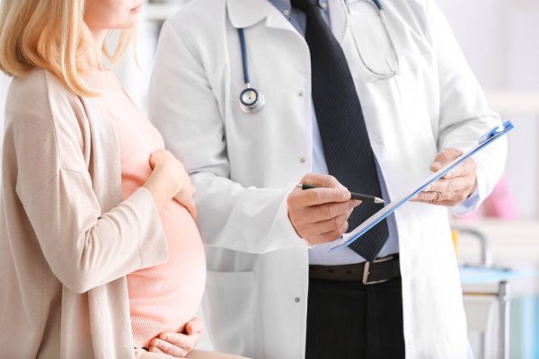 Pregnant woman visiting cardiologist Pregnant woman visiting cardiologist